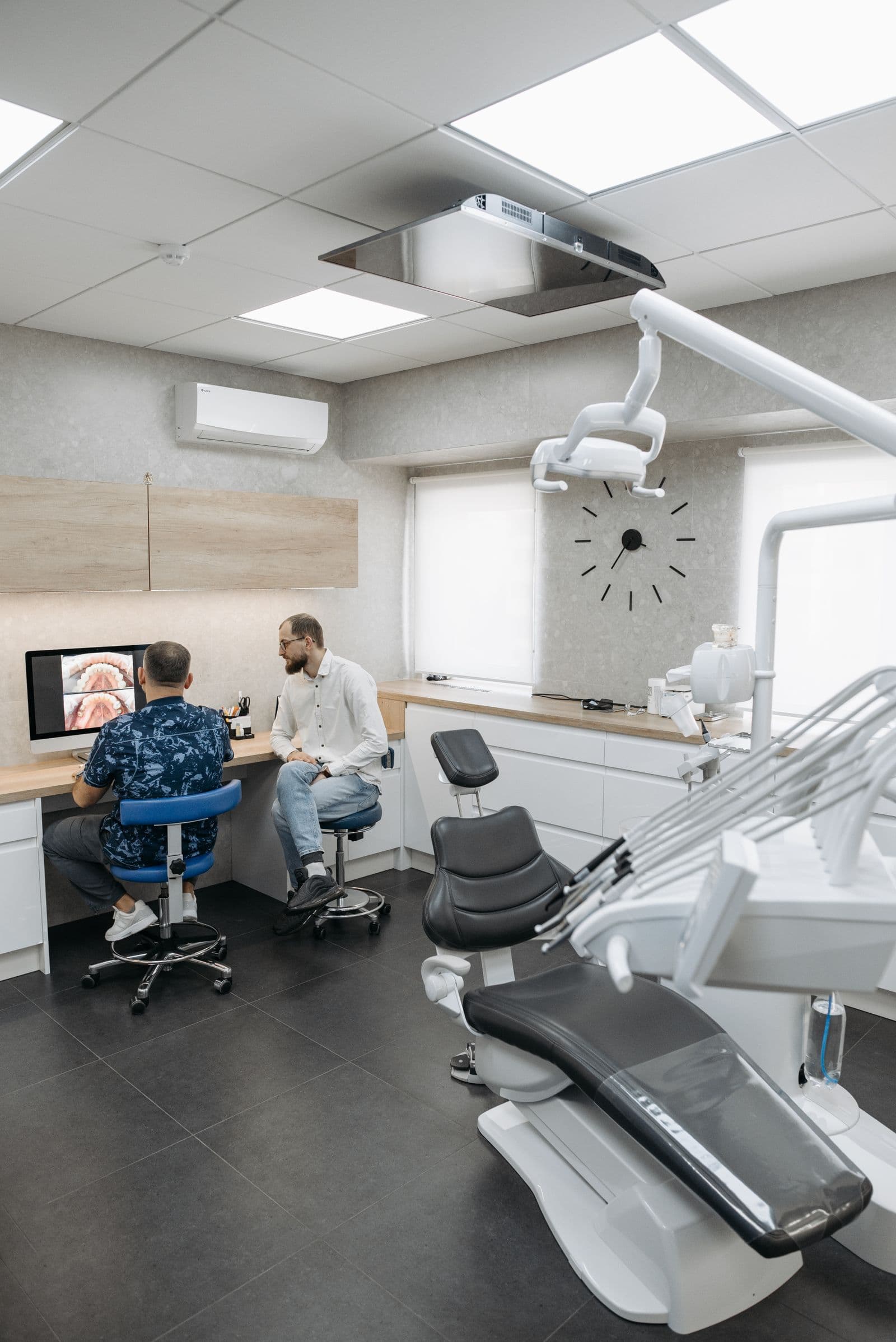 A dentist talking through a treatment plan with a patient